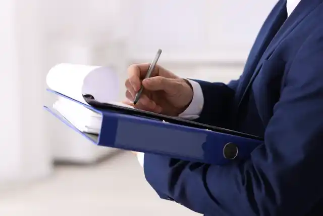 Official recording clerk reviewing property and deed records in Brevard County Florida.