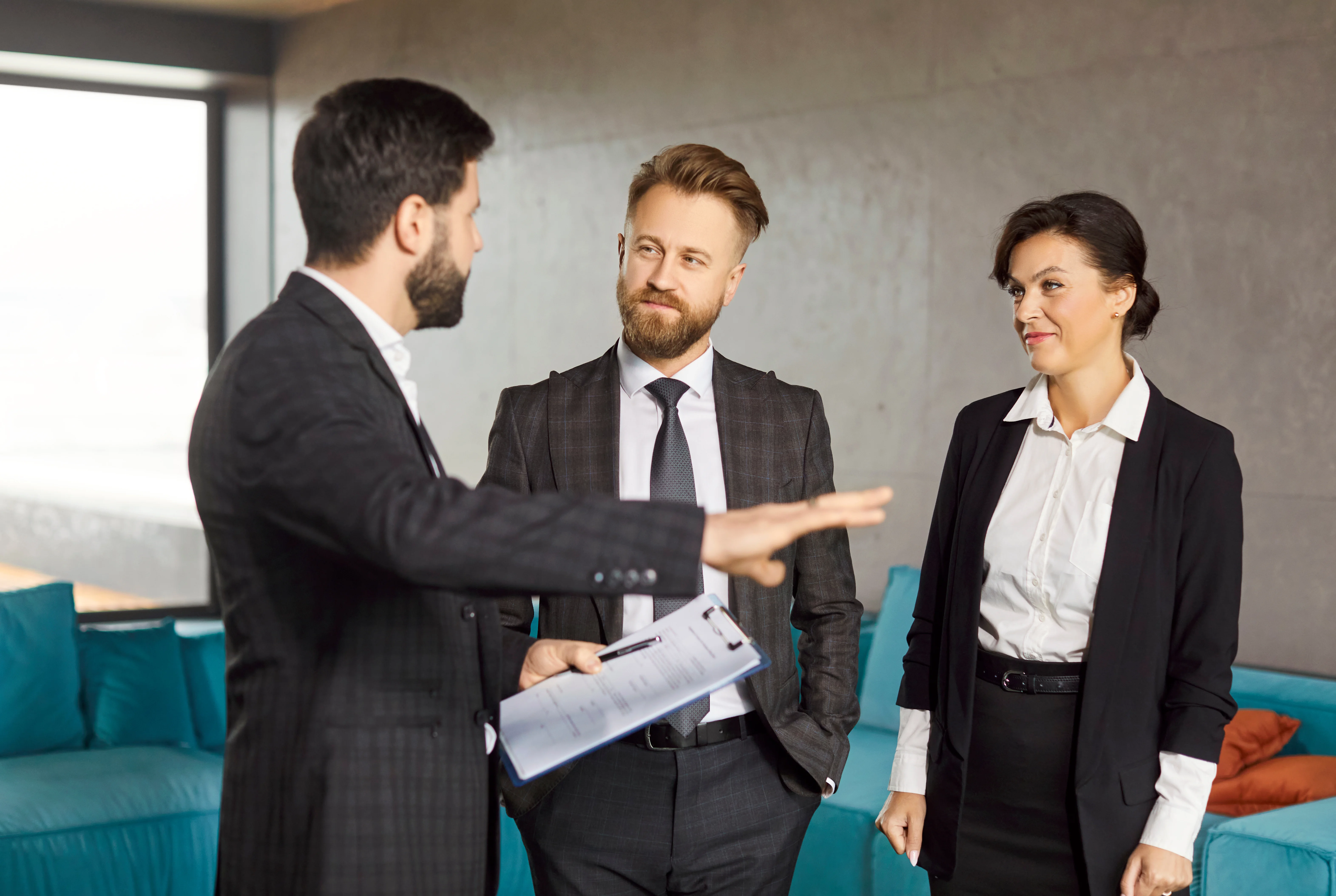 Business professional explaining rental management options to clients — when to hire a property manager.