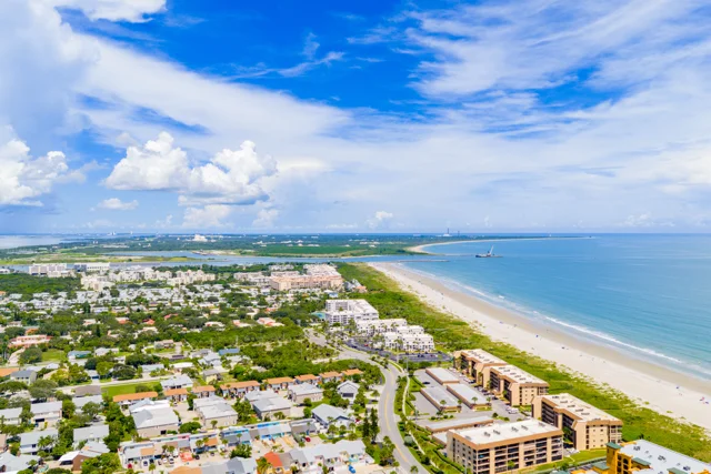 Aerial view of Florida’s Space Coast with beachfront properties and residential neighborhoods, representing rental market opportunities.