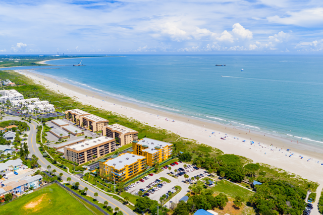 Aerial view of beachfront condos along Florida’s Space Coast with oceanfront access and sandy beaches.